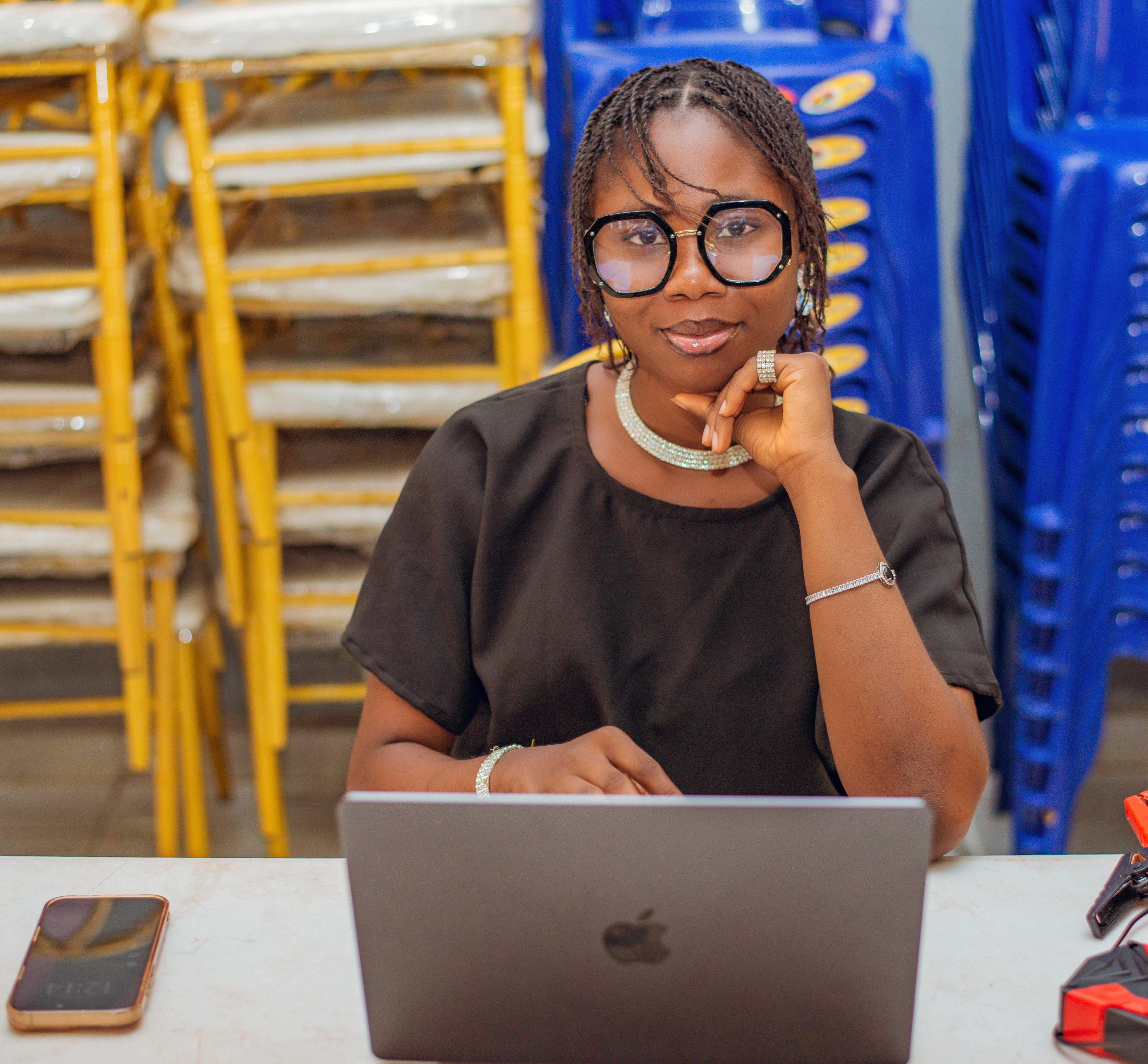 Helen Omotayo working at her laptop