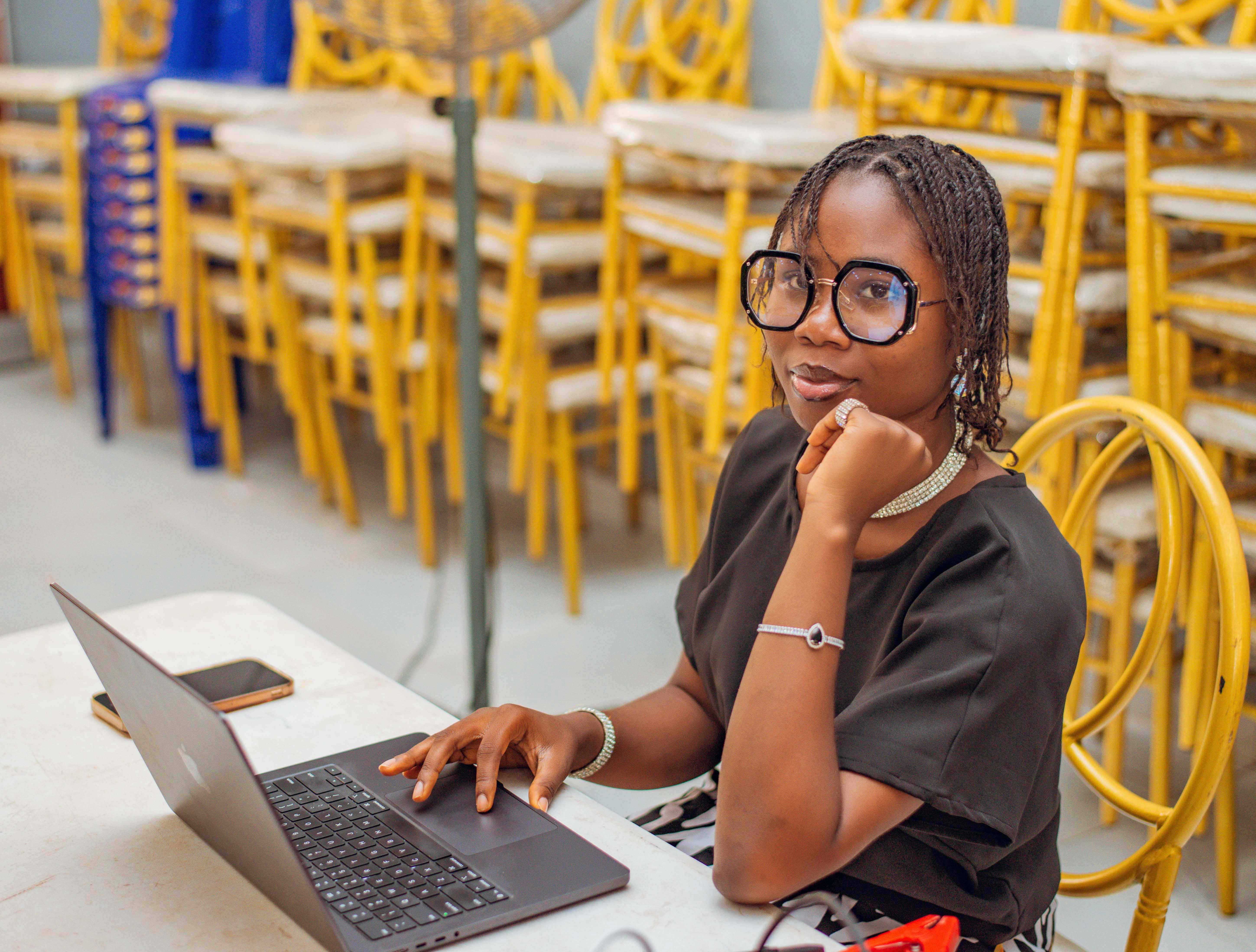 Helen Omotayo at work on her laptop